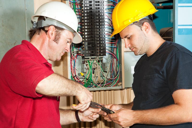 Electricians Repair Circuit Breaker stock photography