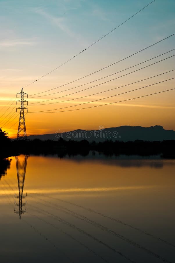 An electricity pole in sunset