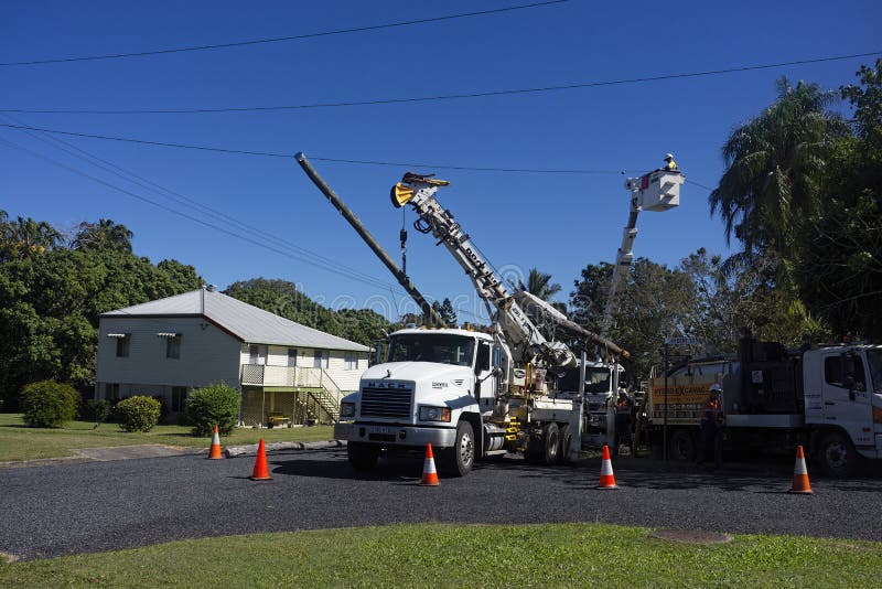 Power Workers Connecting New Electricity Lines. Editorial Stock Photo