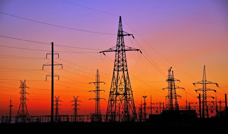 PHOTO ELECTRICITY PYLONS AGAINST SUNSET. Red pylons stock images, royalty-free photos and pictures