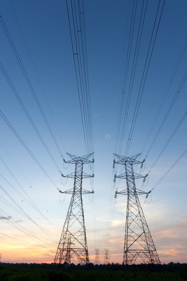 Electricity pylons at sunset