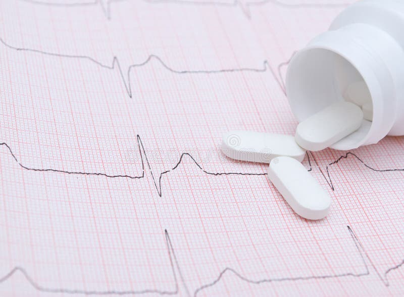 Electrocardiogram graph and pills