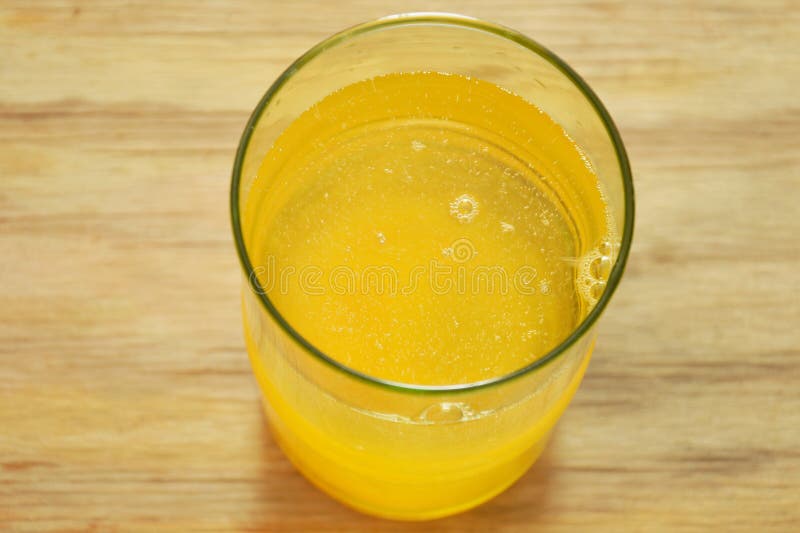 Electrolyte Orange Flavor Powder Dissolution in Freshwater Stock Photo