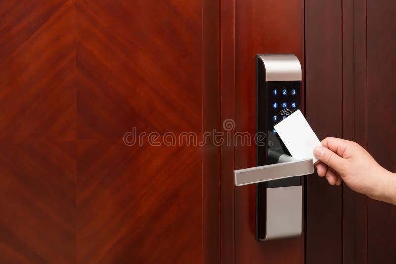 Electronic door lock opening by an blank security card stock photography
