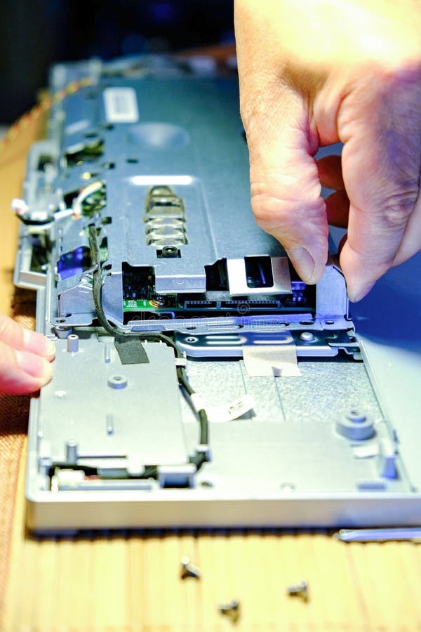 Service maintenance of computers. The wizard replaces the RAM, increasing the performance of the computer. Master removes the royalty free stock photos