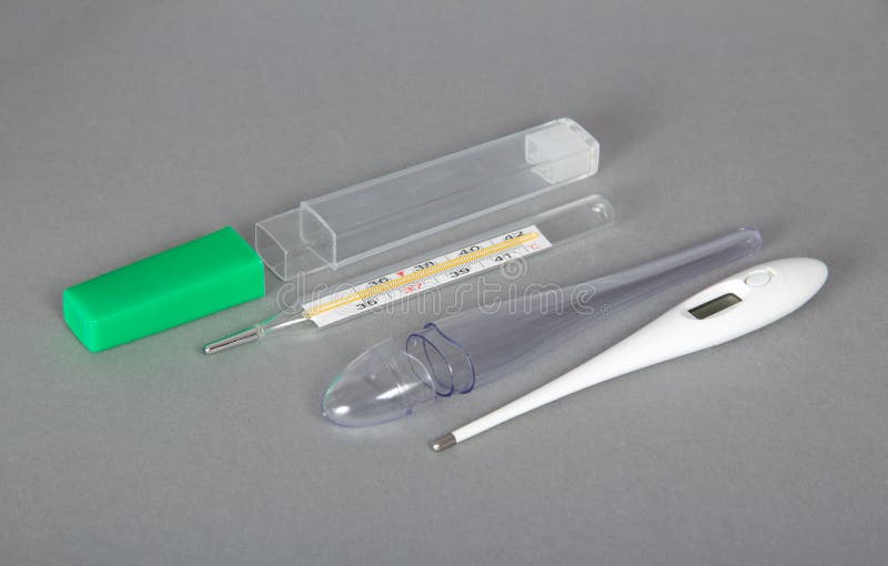 Electronic and Mercury Thermometers with Cases Stock Photo Image of