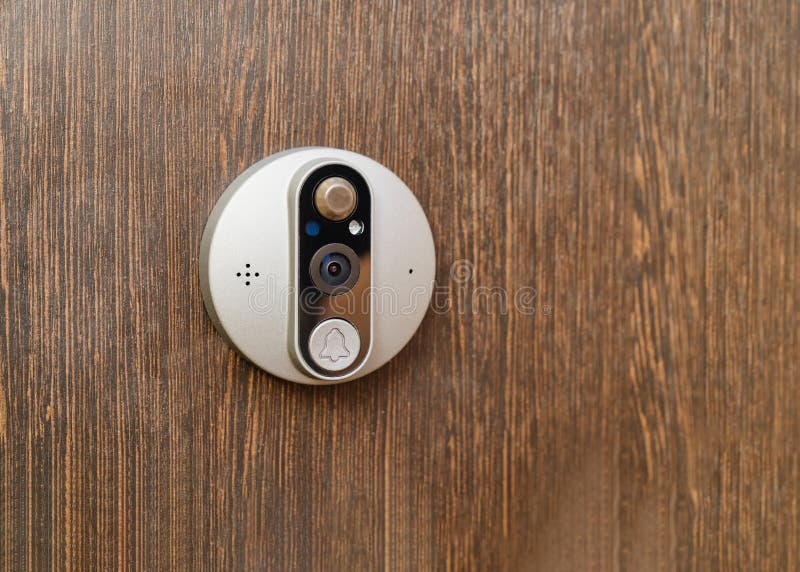 Electronic of the peephole with call button or intercom on the front door. stock photography