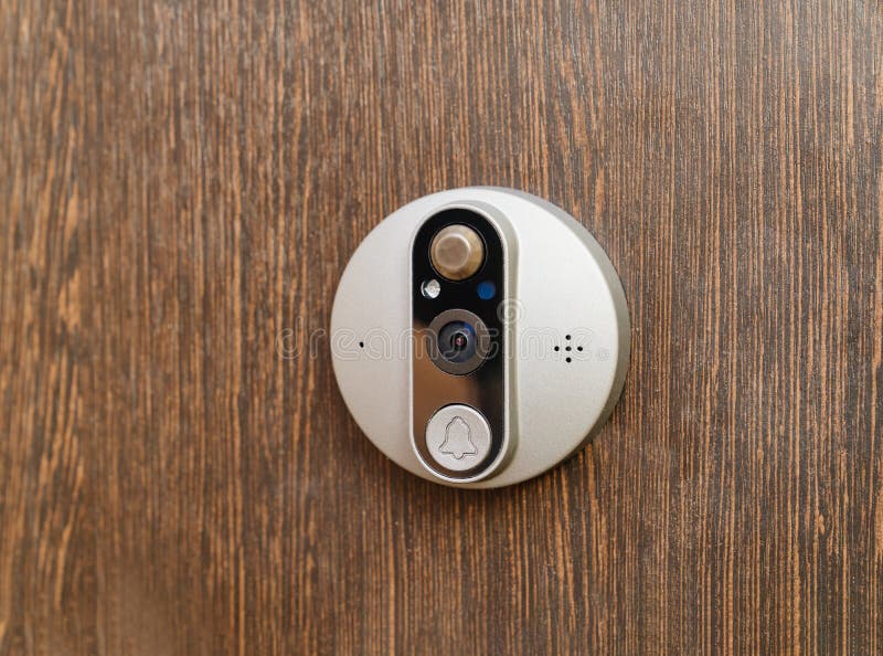 Electronic of the peephole with call button or intercom on the front door. royalty free stock photo