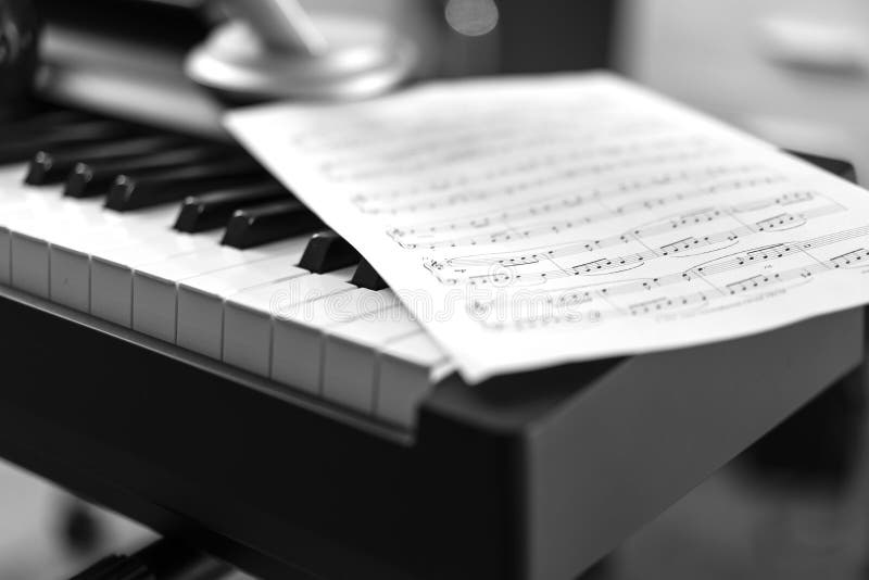Electronic Piano and Musical Sheet . Black and White Photo, Musical ...