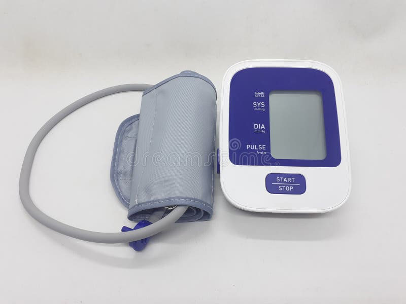 An electronic sphygmomanometer / blood pressure meter on white isolation background royalty free stock photo