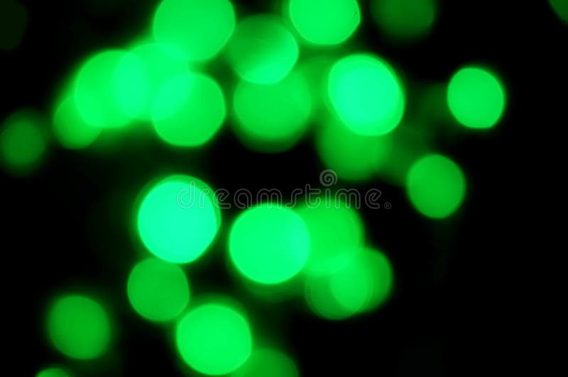Elegant abstract green bokeh defocused lights dots background royalty free stock images