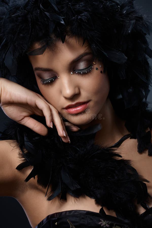 Elegant beauty with feather boa