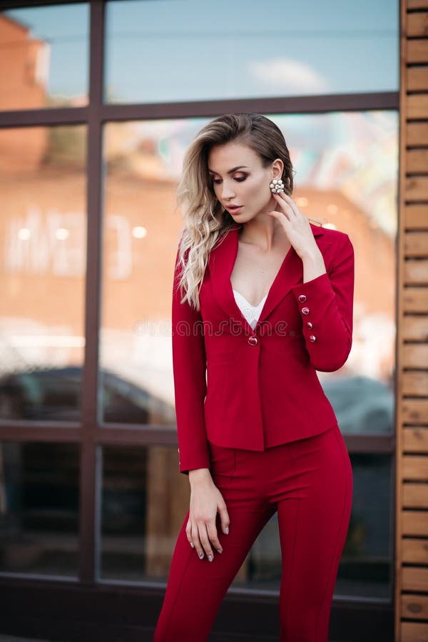 Elegant Blonde Woman in Dark Red Suit with Gold Buttons. Stock Photo ...