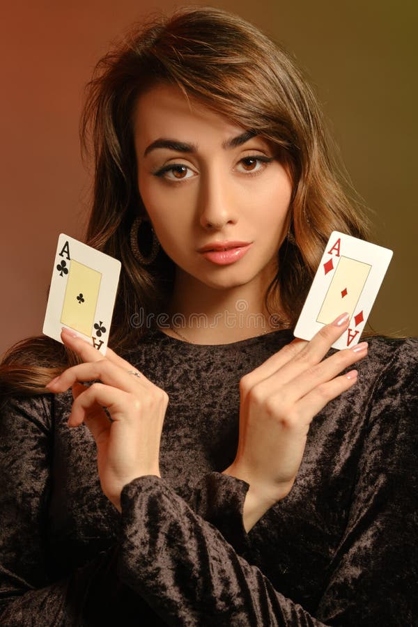 Brunette Maiden In Black Velvet Dress And Jewelry Showing Two Aces