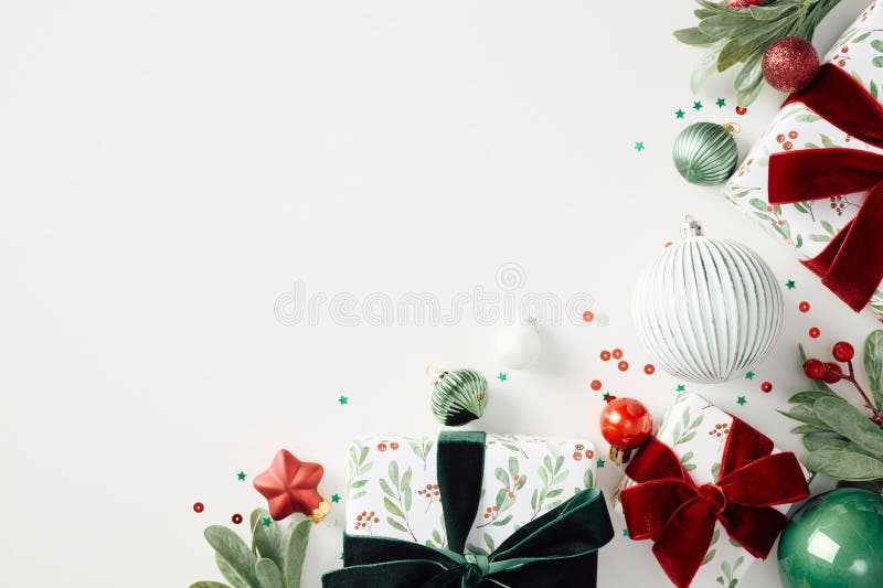 Elegant Christmas gifts and ornaments on white background. Flat lay, top view