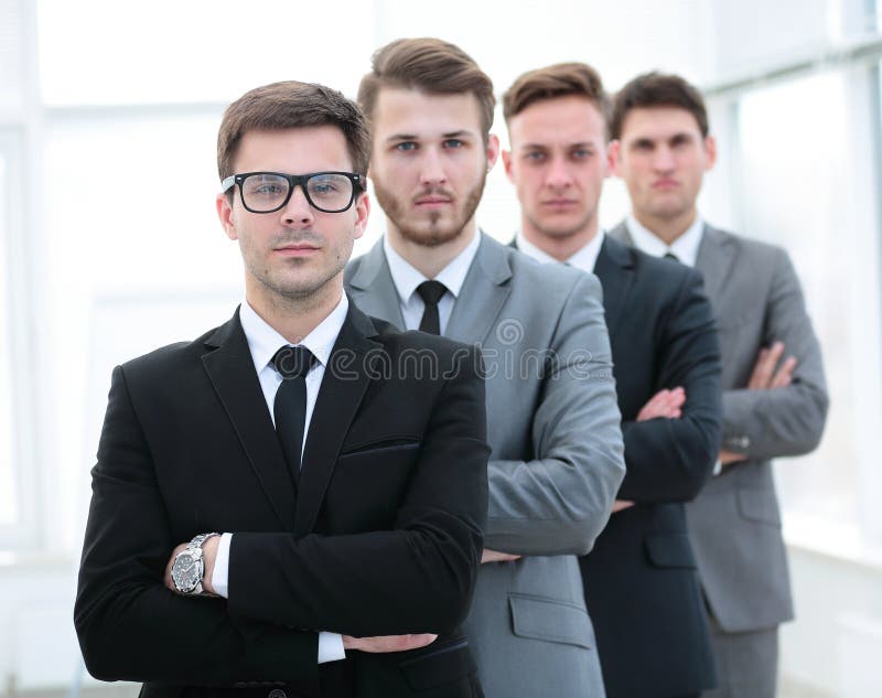 Elegant co-workers looking at camera during meeting in office