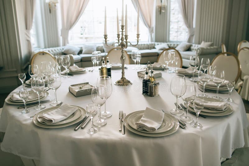 Elegant dining  table setting in the restaurant for the wedding dinner