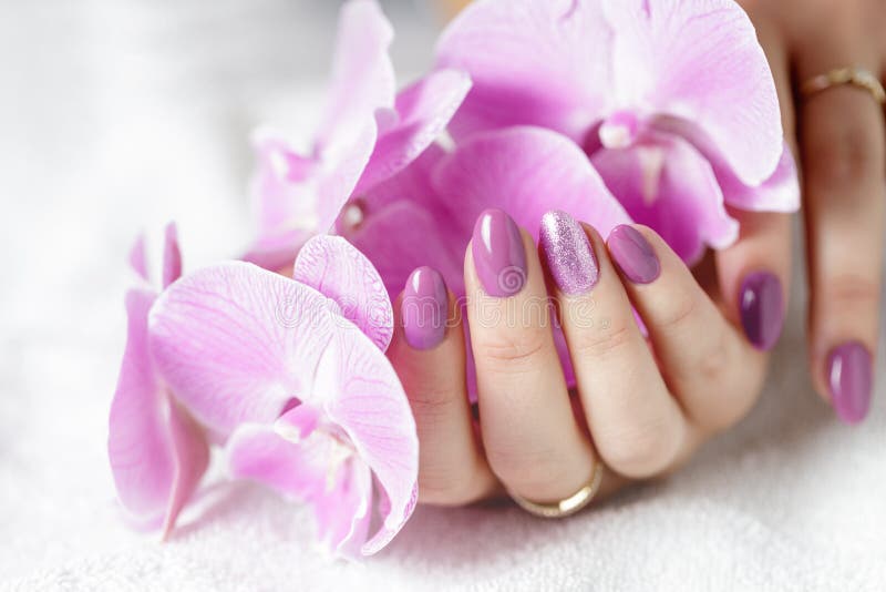 Manicure, orchid and beads stock photo. Image of lacquer - 14006638