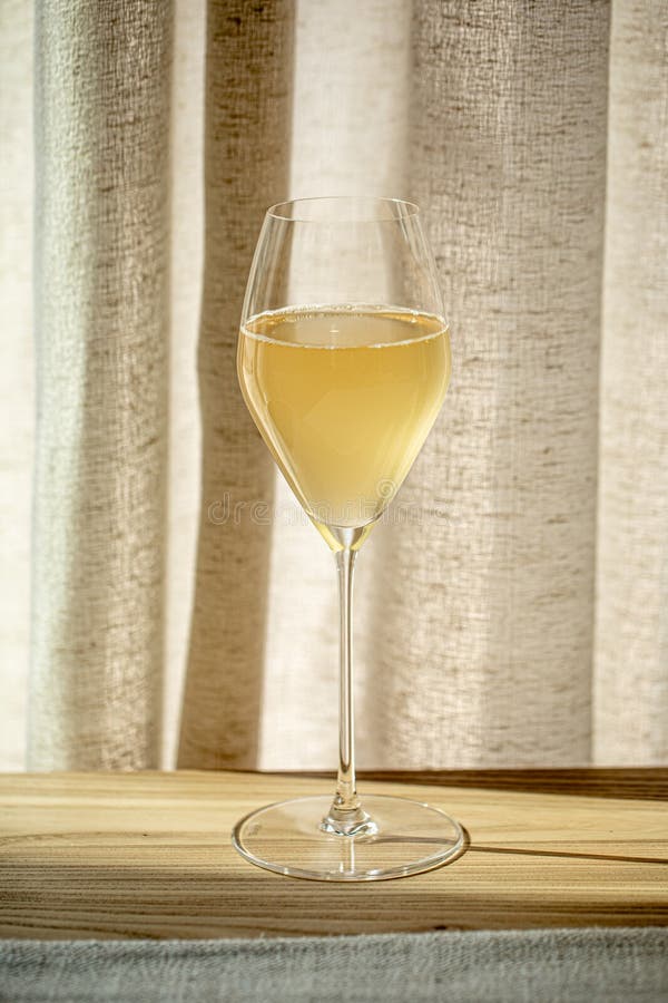 Elegant glass of wine cocktail on wooden table stock photos