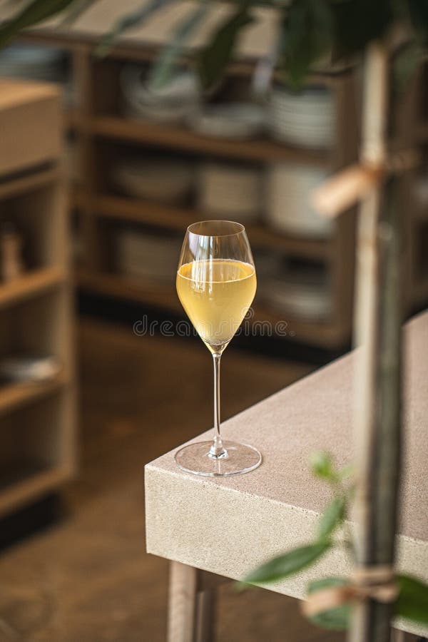 Elegant glass of wine cocktail on wooden table royalty free stock image