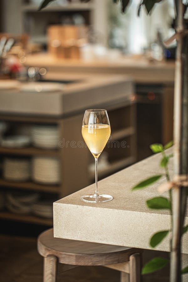 Elegant glass of wine cocktail on wooden table stock image