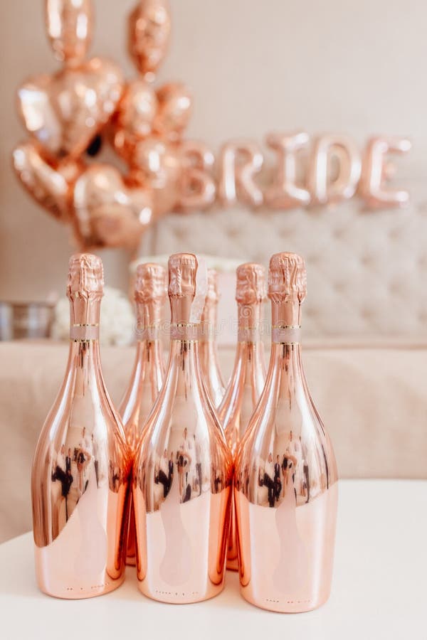 Elegant Glossy Bottle of Champagne On White Table royalty free stock photo