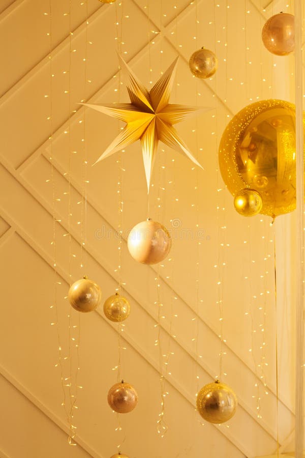 Elegant Golden Background with Garland Light and Gold Decorations Stock