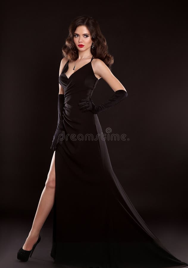 Beautiful Brunette Woman With Gothic Makeup Wearing Stylish Black Dress And  Posing On Grey Background Stock Photo, Picture and Royalty Free Image.  Image 132839563.