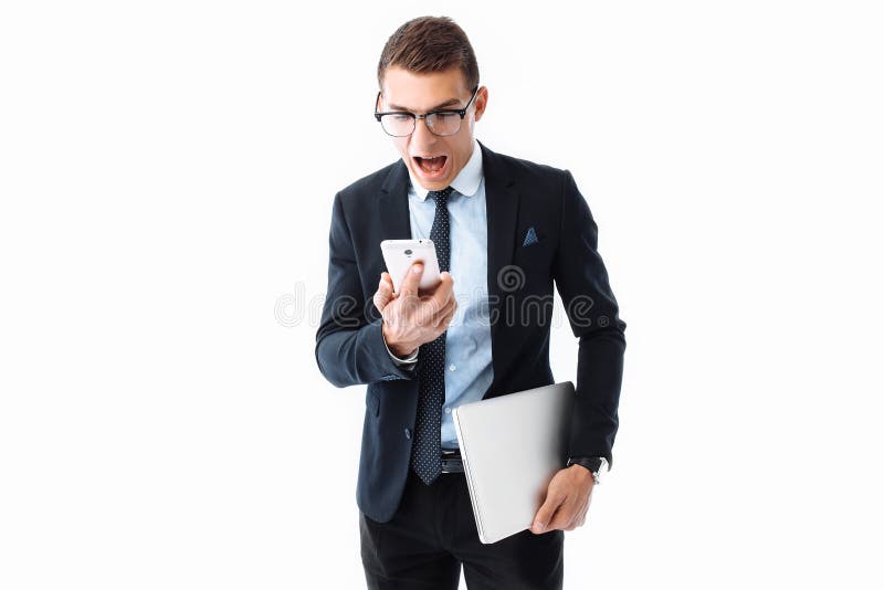 Elegant man, in a suit and glasses, looks at the phone screen, a stock photos Elegant man, in a suit and glasses, looks at the phone screen, a stock photos