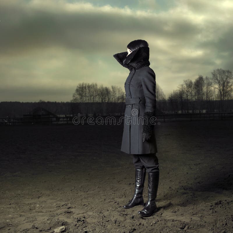 Elegante meisje in een jas stock foto