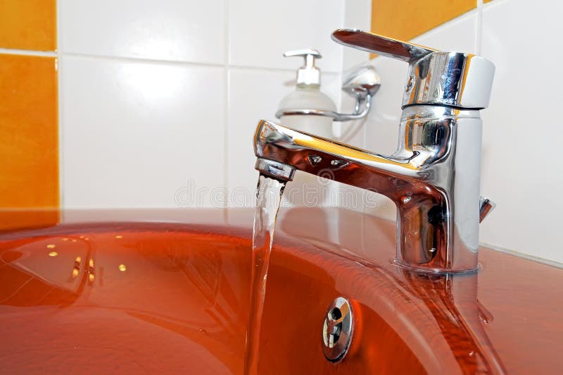 Modern orange sink stock photo. Image of drop, apartment 8088080