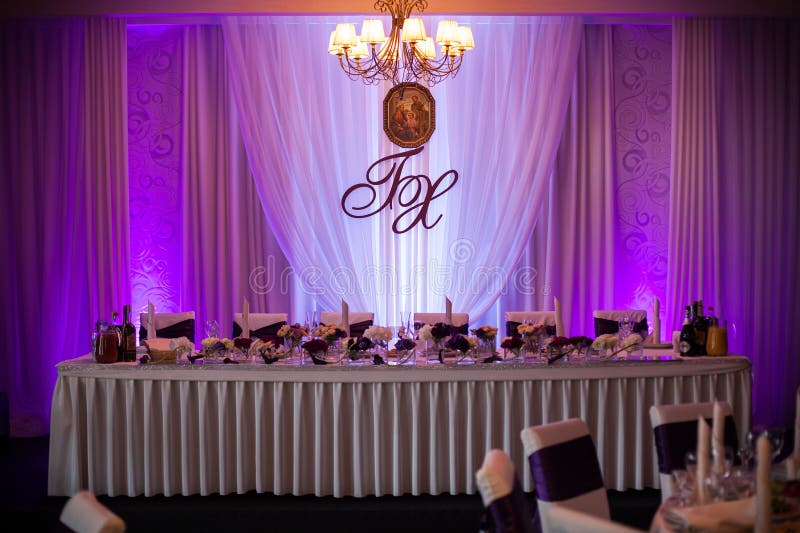 Elegant and stylish purple color wedding reception at luxury restaurant