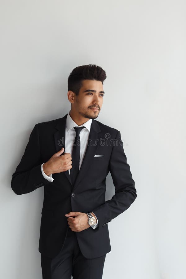 Elegant stylish young handsome man in a suit. Studio fashion portrait royalty free stock photo Elegant stylish young handsome man in a suit. Studio fashion portrait royalty free stock photo