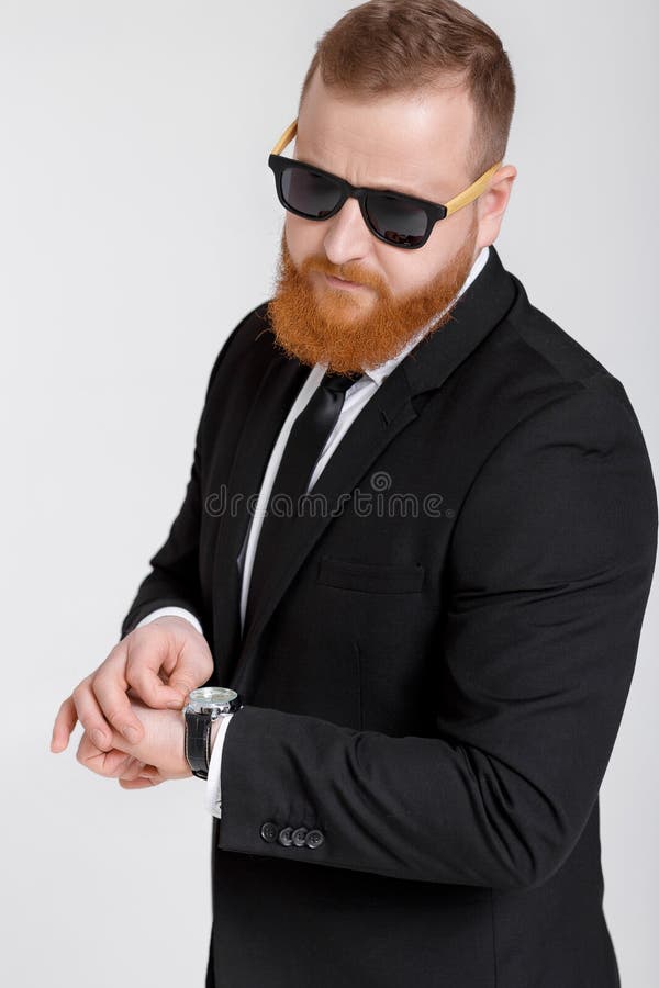 Business man looking at watch