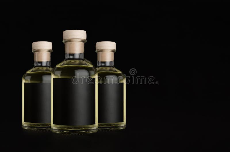 Download Three Glass Bottles For Cosmetic Perfume Drink With Black Label Cork Yellow Liquid On Black Background Mock Up For Design Stock Image Image Of Identity Collection 171947913 Yellowimages Mockups