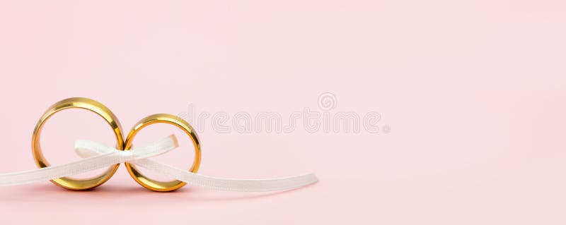 Elegant Wedding or Engagement Banner Background - Pair of Golden Wedding  Rings on Light Pink Background Stock Photo - Image of love, marry: 189625988