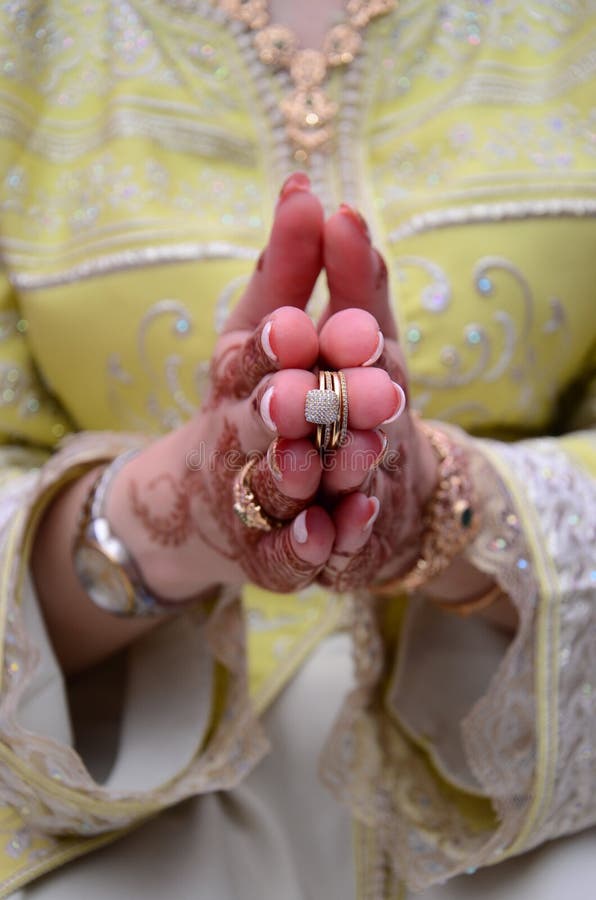 Elegant Wedding Ring with Beautiful Henna of Bride Hand. Stock Photo