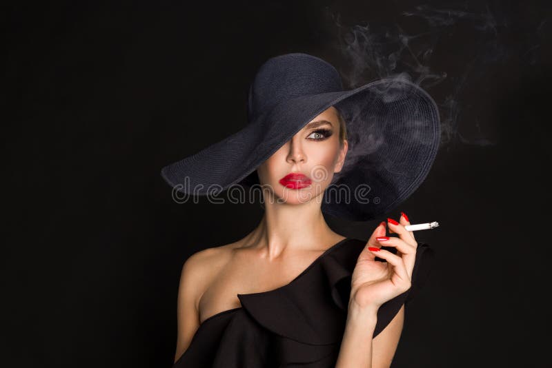 Elegant Woman, Femme Fatale in Black Hat with Cigarette in Hand Stock ...