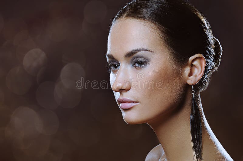 Elegant beautiful woman with natural makeup and boke lights. Elegant beautiful woman with natural makeup and boke lights