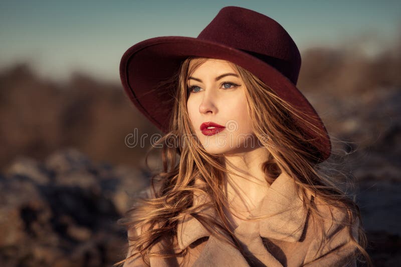 elegant woman with red lips in hat