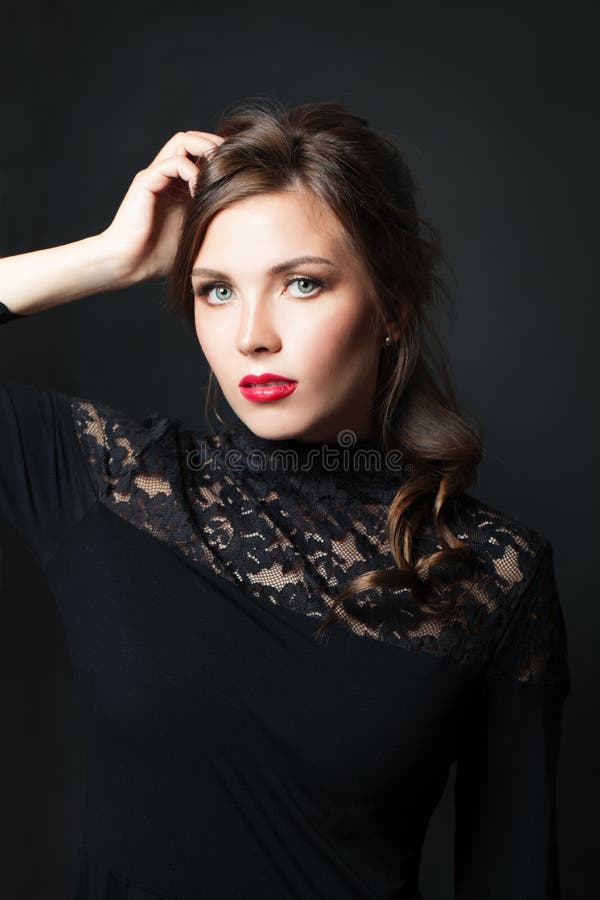Elegant woman with red lips makeup hair on dark background royalty free stock photo Elegant woman with red lips makeup hair on dark background royalty free stock photo