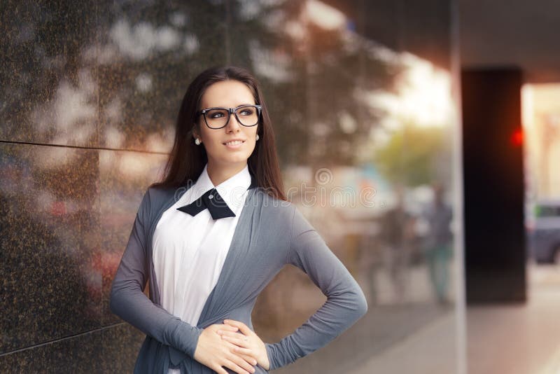 Elegant Woman Wearing Glasses Standing Out in The City stock photo Elegant Woman Wearing Glasses Standing Out in The City stock photo