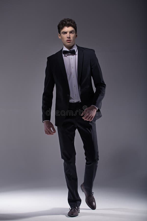Elegant young model wearing suit royalty free stock photos