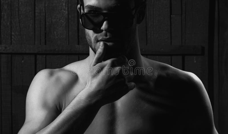 Elegant young sexy man wearing glasses. Closeup face, sensual gay.