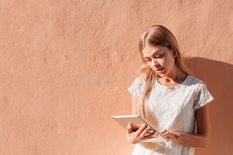 Elegant young woman using tablet