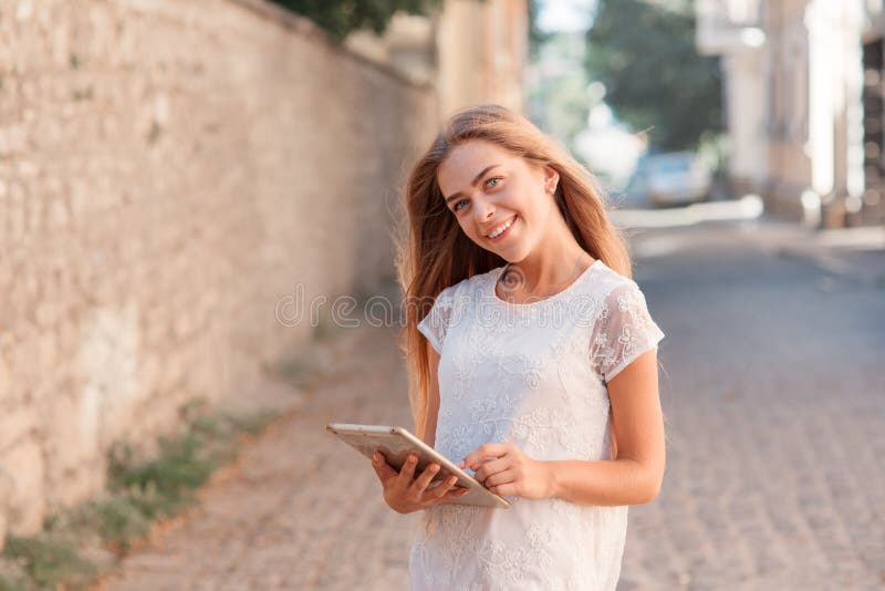 Elegant young woman using tablet