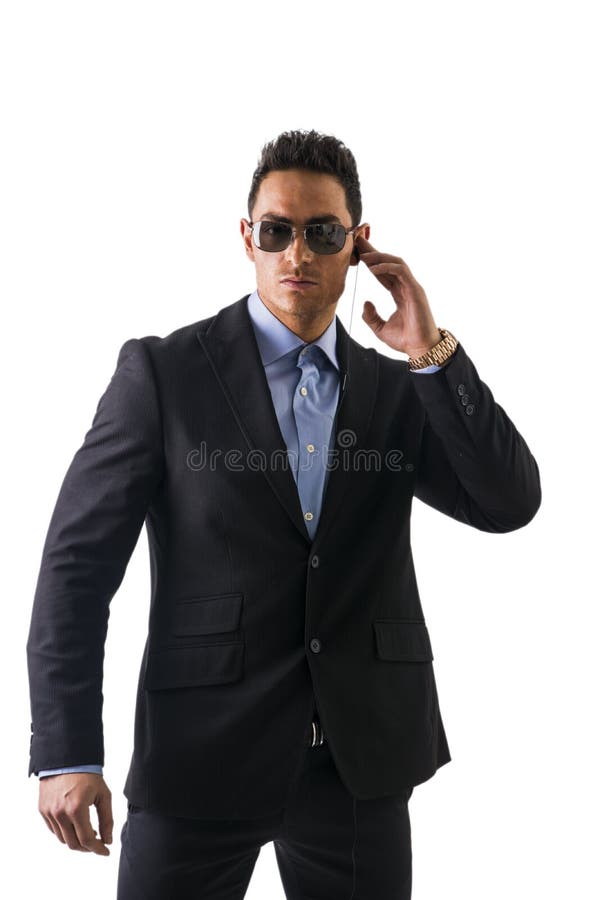 Eleganter Mann mit Kopfhörern, ein Sicherheitspersonal stockfoto Eleganter Mann mit Kopfhörern, ein Sicherheitspersonal stockfoto