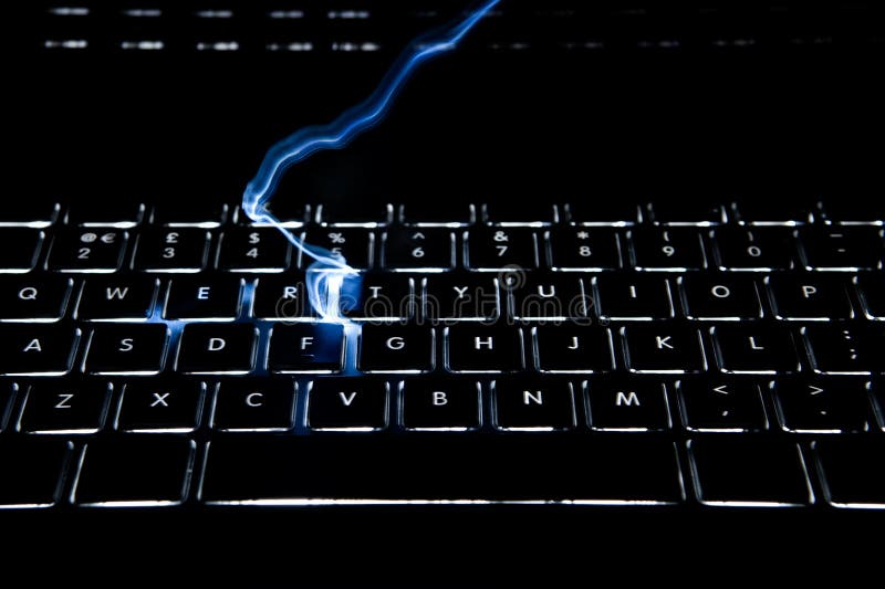 Keyboard with full alphabet backlit has lightning striking the keys. Keyboard with full alphabet backlit has lightning striking the keys