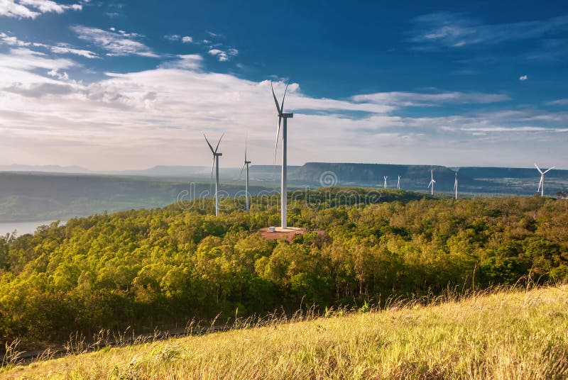 Electric wind turbine view with blue sky above the dam. Khao Yai Tieng, Nakhon Ratchasima provinces, Thailand. Electric wind turbine view with blue sky above the dam. Khao Yai Tieng, Nakhon Ratchasima provinces, Thailand