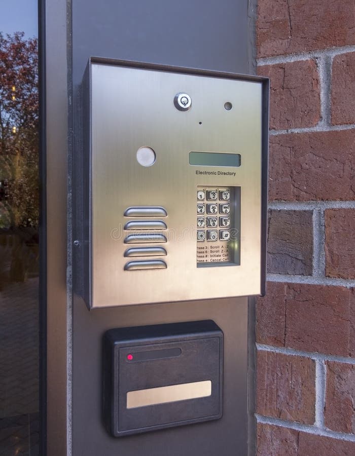 Electronic door directory and security pad near the front door entrance of a commercial building. Electronic door directory and security pad near the front door entrance of a commercial building